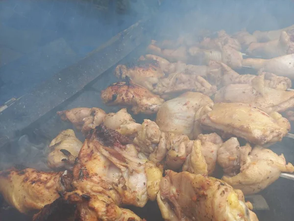chicken on the grill. fried chicken on fire. meat on skewers. chicken kebab. cooking meat on fire. home grill. barbecue food.
