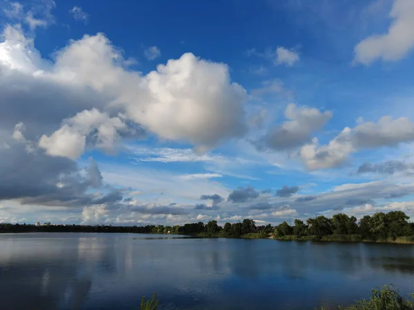 beautiful landscape with water and clouds. Ukraine. Ukrainian landscape. beautiful evening landscape. natural wallpaper. wide river. summer evening on the river.