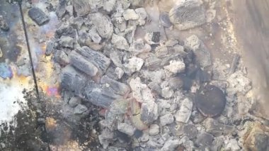 gray ash. coals. fire and ashes. coals and smoke. burnt firewood. fire. red flame.