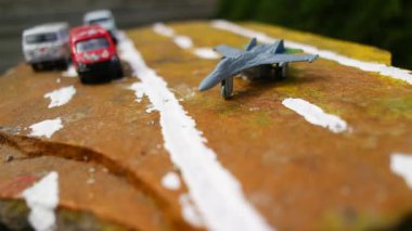 aircraft on the runway. combat fighter. military jet aircraft parked on runway in sunset. fighter jet plane landing/take off over the runway. toy plane.