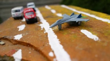 aircraft on the runway. combat fighter. military jet aircraft parked on runway in sunset. fighter jet plane landing/take off over the runway. toy plane.