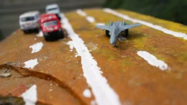 aircraft on the runway. combat fighter. military jet aircraft parked on runway in sunset. fighter jet plane landing/take off over the runway. toy plane.