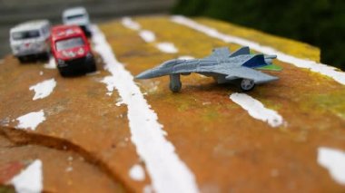 aircraft on the runway. combat fighter. military jet aircraft parked on runway in sunset. fighter jet plane landing/take off over the runway. toy plane.