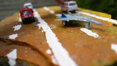 aircraft on the runway. combat fighter. military jet aircraft parked on runway in sunset. fighter jet plane landing/take off over the runway. toy plane.
