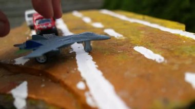 aircraft on the runway. combat fighter. military jet aircraft parked on runway in sunset. fighter jet plane landing/take off over the runway. toy plane.