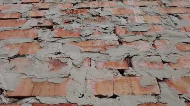水泥和石头 一排排的砖头墙的纹理 4K视频 红砖墙全景背景的深褐色红砖墙的结构 — 图库视频影像