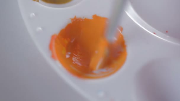 Mixing Orange Tones — Stockvideo