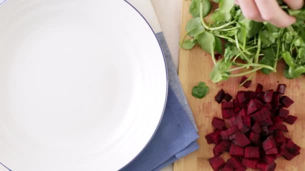 Adding Watercress to Salad — Stock video