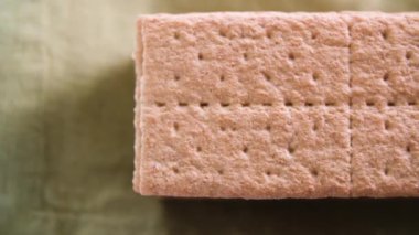 Top down tracking shot of stack of graham cracker cookies