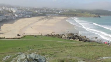 Beach area at St Ives England in Cornwall viewed from the Island on a cloudy day.