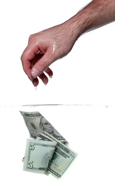 Hand en dollar biljetten in water — Stockfoto