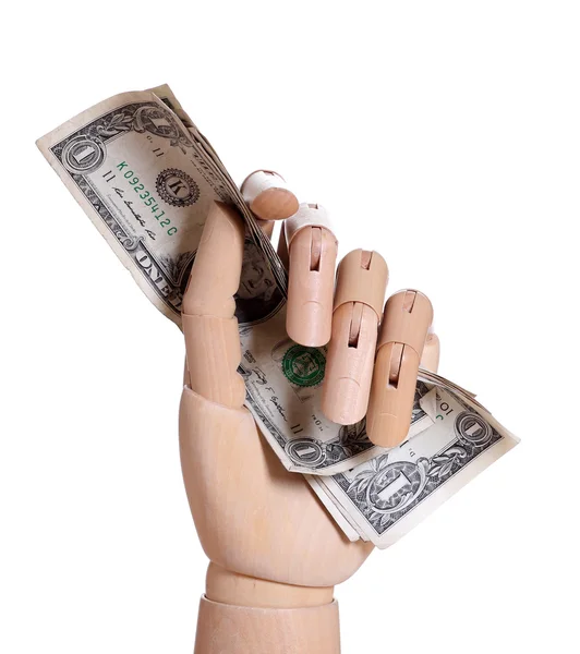 Wooden hand holding dollars — Stock Photo, Image