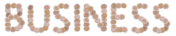 Business - written with coins on white background — Stock Photo, Image