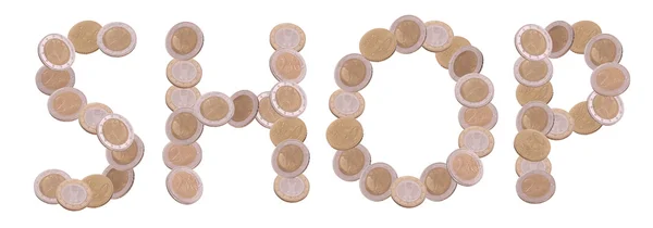 Loja - escrito com moedas em fundo branco — Fotografia de Stock