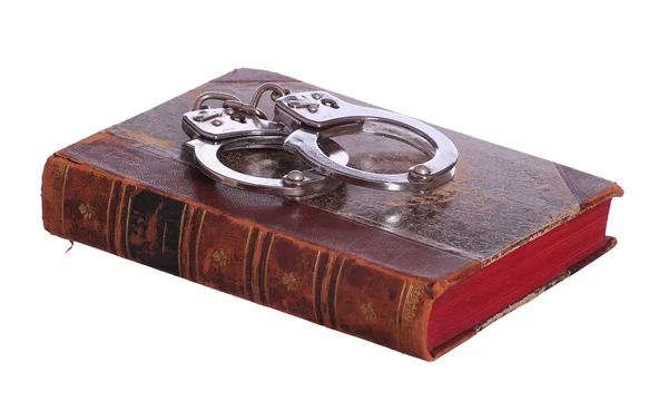 Old book with handcuff — Stock Photo, Image