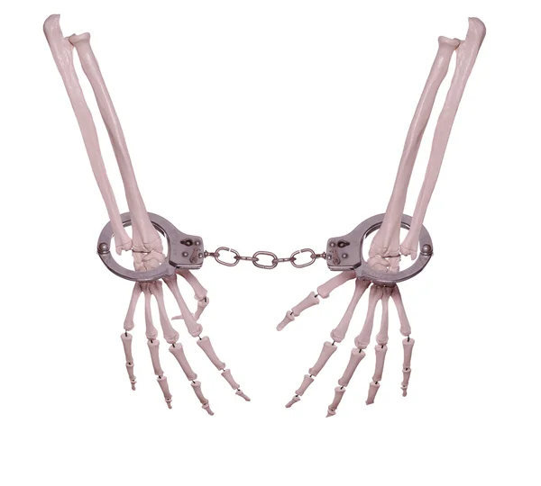 Skeleton hands in handcuffs — Stock Photo, Image