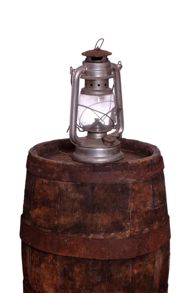 Wooden barrel with oil lamp — Stock Photo, Image