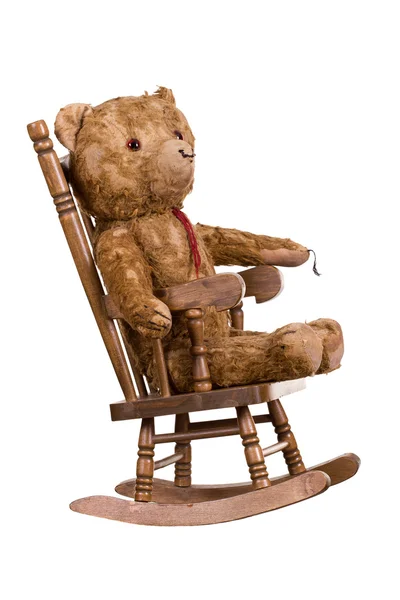 Old teddybear on wooden chair — Stock Photo, Image