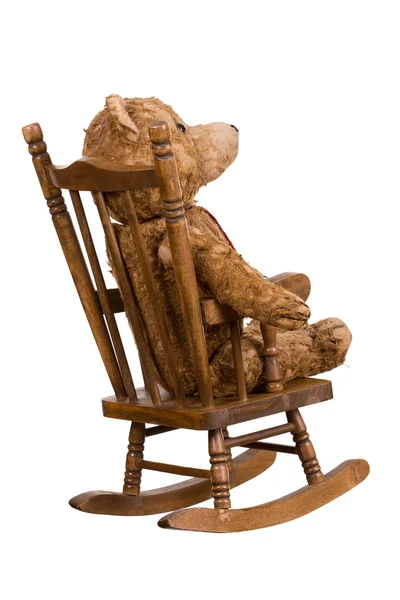 Old teddybear on wooden chair — Stock Photo, Image