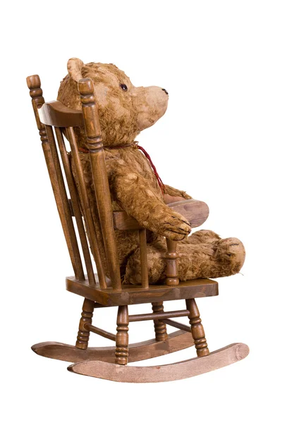 Old teddybear on wooden chair — Stock Photo, Image
