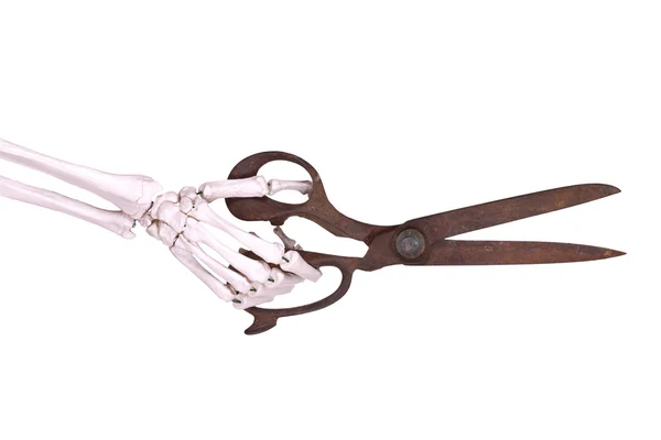 Skeleton hand with old scissors — Stock Photo, Image