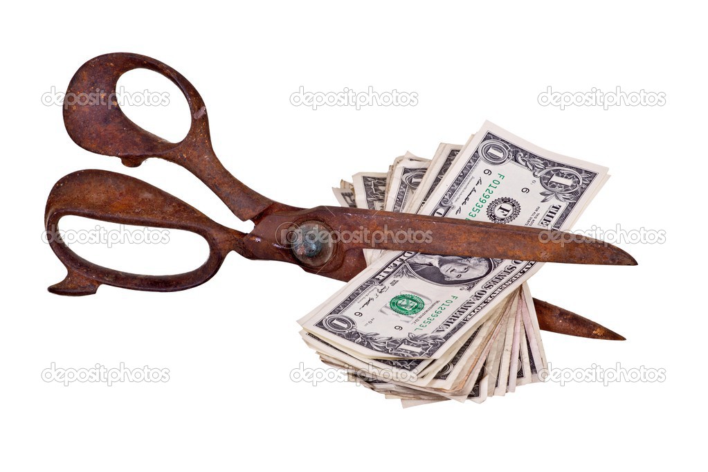 Old scissors with dollars