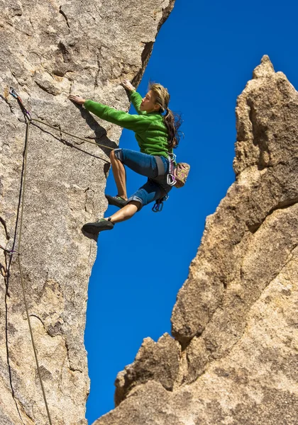 Climber dangles on the edge. Stock Image