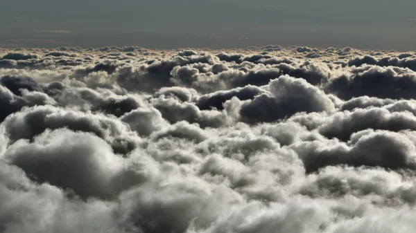 Top view of the clouds in the morning light. Aerial view of cumulus clouds. — Stockfoto