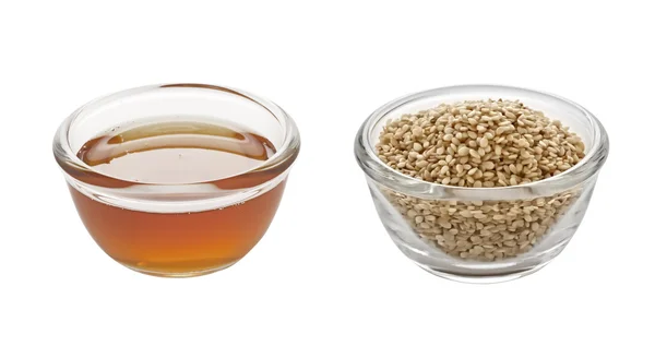 Sesame oil and seeds — Stock Photo, Image