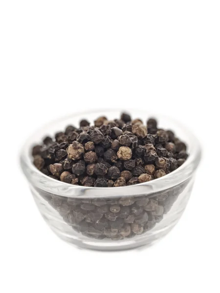 Black peppercorns blur — Stock Photo, Image