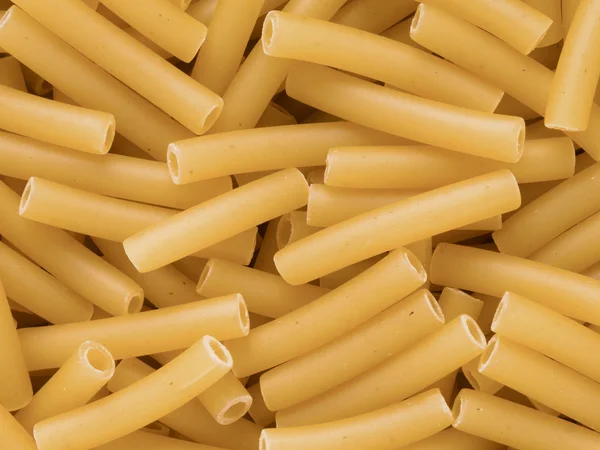 Macaroni tubes de pâtes fond alimentaire — Photo