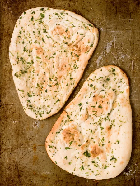 Rustic indian garlic and parsley naan bread — Stock Photo, Image