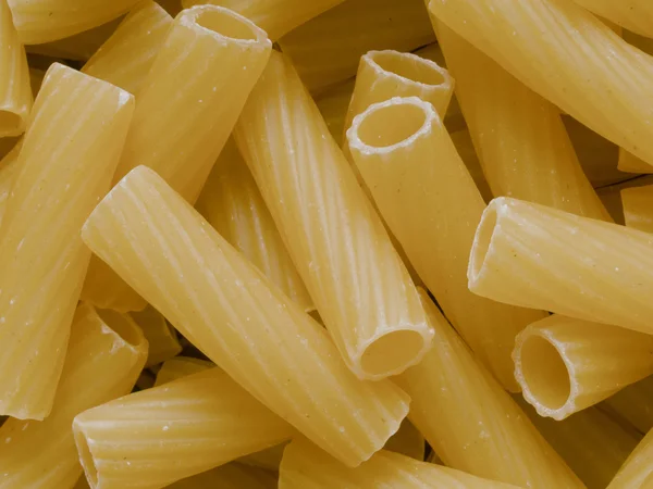 Okokt maccheroni pasta rör mat textur bakgrund — Stockfoto