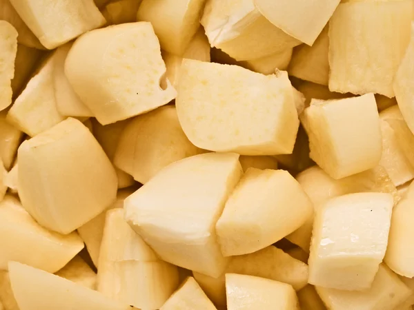 Pozadí potraviny nakrájené syrové syrového česneku — Stock fotografie