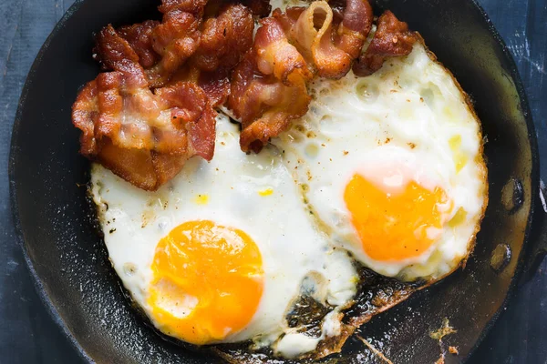 Close Pan Bacon Fat Fried Eggs Breakfast — стоковое фото