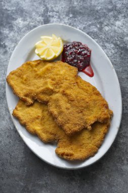 close up of golden breaded german schnitzel