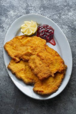 close up of golden breaded german schnitzel