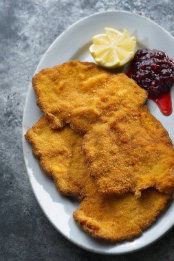 close up of golden breaded german schnitzel