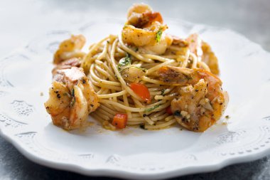  close up of italian spicy garlic shrimp pasta                              