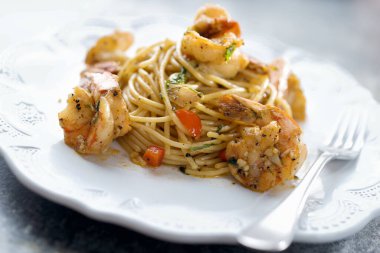  close up of italian spicy garlic shrimp pasta                              