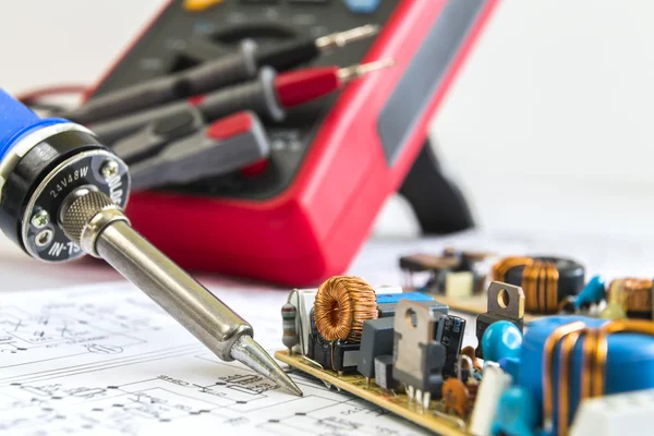 Soldering iron and 12V pulse source — Stock Photo, Image