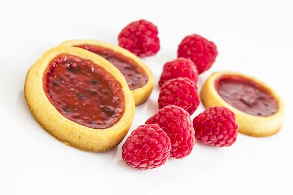 Fresh raspberry biscuits with a few beries — Stock Photo, Image