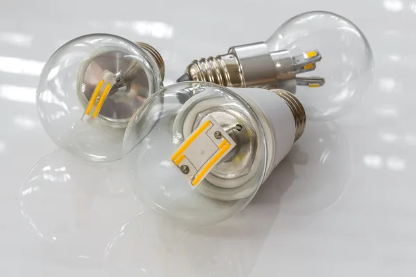E27 LED bulbs with different light-emitting chips in transparent — Stock Photo, Image