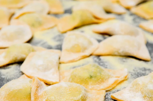 making home-made ravioli pasta from scratch with goat cheese and