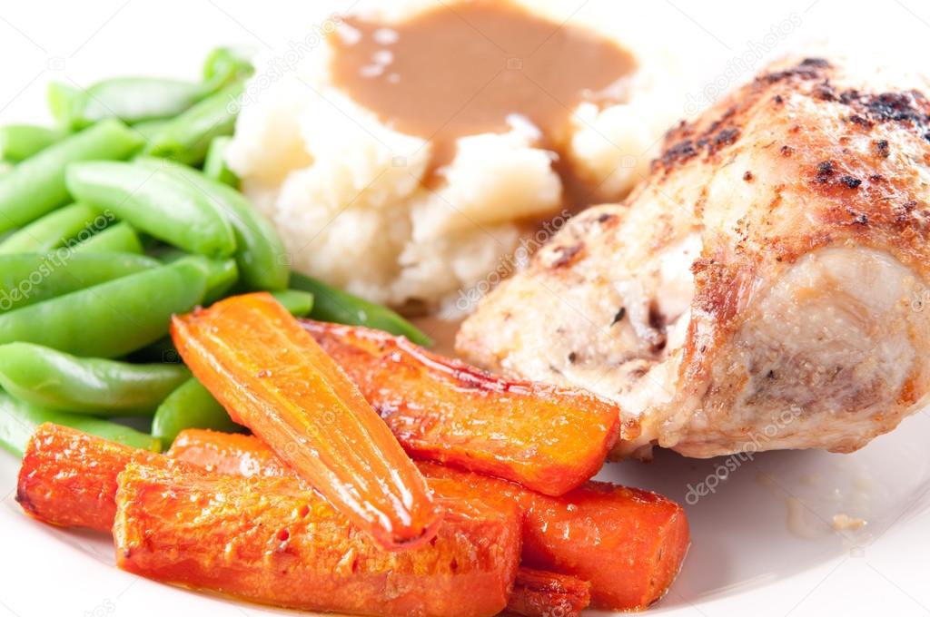roasted chicken breast with mashed potatoes, gravy and fresh veg