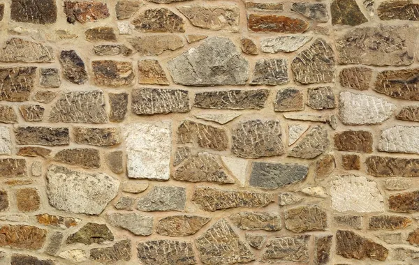 Sillón sin costuras viejo muro de piedra textura de fondo —  Fotos de Stock
