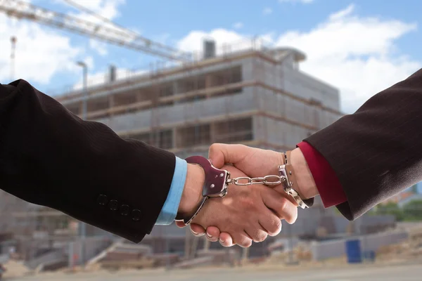 Handshake with handcuff — Stock Photo, Image