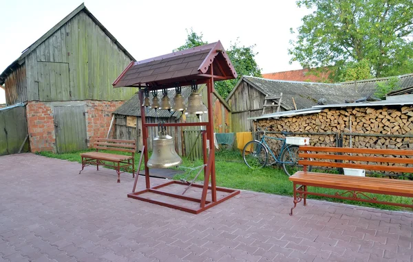 Figurative folding belfry with church bells in a yard of the rur — Stock Photo, Image