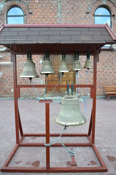 Church bells on a figurative folding belfry — Stock Photo, Image