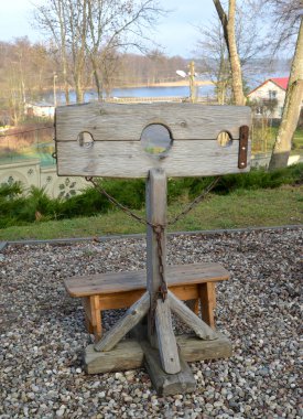 Pillory in the lock Ryn, Poland clipart